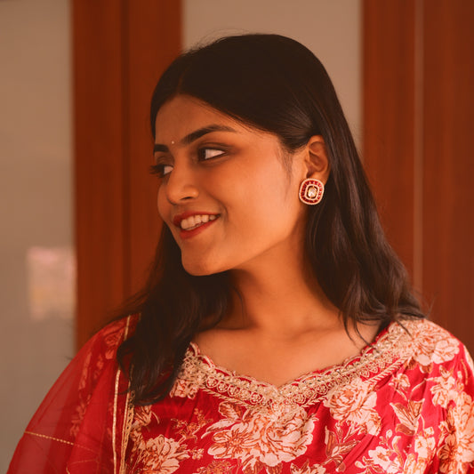 Real kundan tops lined with ruby coloured baguette stones.