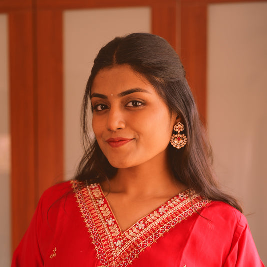 Mid sized Statement earrings in real Kundan and royal ruby red stone.